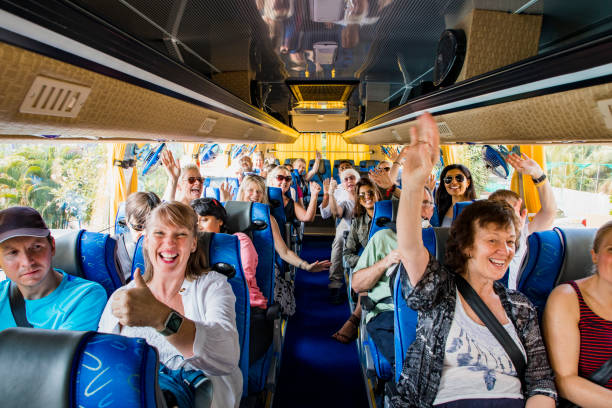 group of happy people in bus